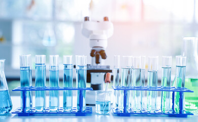 Laboratory research, microscope with lab glassware, science laboratory research and development concept.