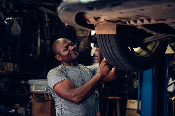 Fototapeta na wymiar Auto mechanic are repair and maintenance auto engine is problems at car repair shop.