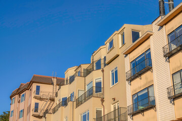 Apartment buildings with painted walls and railings in San Francisco, California
