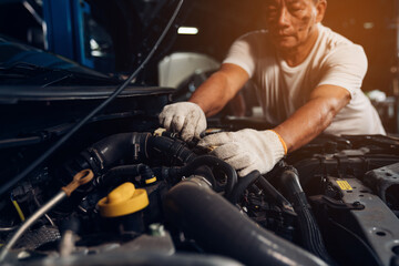 Auto mechanic are  repair and maintenance auto engine is problems at car repair shop.