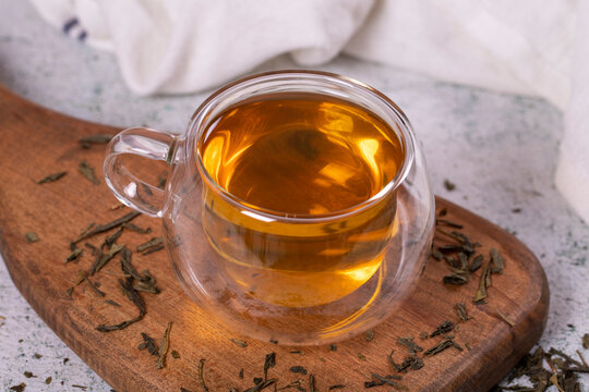 Green Tea. Green Tea In A Wooden Serving Dish On A Stone Background. Healthy Drinks. Herbal Tea Concept. Close Up