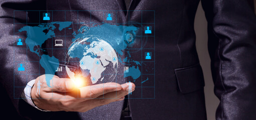 Success Businessman with digital technology link internet connection network earth global financial world banking on open hand.hologram icon and business world success technology on black background