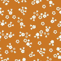 Simple vintage pattern. small white flowers and leaves. orange  background. Fashionable print for textiles and wallpaper.