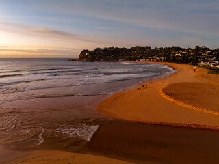 Sunrise and high cloud cover by the sea and lagoon