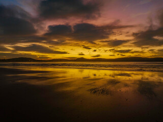 Fototapeta na wymiar Winter sunrise at the seaside with high cloud and reflections