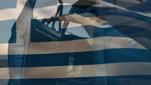 Animation of greece flag waving over african american man getting in pick-up truck at beach