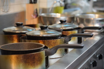 Pots on the gas stove and cooking in the kitchen. Kitchen pot in restaurant kitchen.