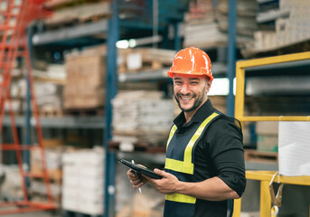 Professional manager man employee using tablet check stock working at warehouse. Worker wearing...