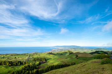Fototapeta na wymiar Pico do Carvão viewpoint facing northern and south coast and natural pastures of São Miguel Island, Azores Portugal