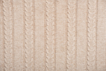 beige knitted texture or background for autumn or winter concept