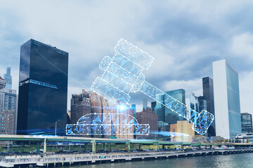 New York City skyline, United Nation headquarters over the East River, Manhattan, Midtown at day time, NYC, USA. Glowing hologram legal icons. The concept of law, order, regulations, digital justice