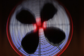 Fan close-up. Air conditioner fan with blur effect. Fan to create wind. View from inside of working...