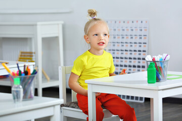 an elementary school student in the classroom at the lesson