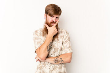 Young caucasian red-haired man isolated on white background contemplating, planning a strategy,...