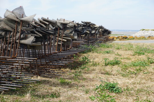 stack of metal grids for harvesting oysters in brittany france on shore by the ocean