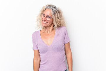 Middle age caucasian woman isolated on white background laughs and closes eyes, feels relaxed and happy.