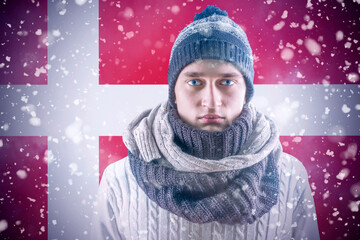 Isolate. Cold weather. Bask. A man in a fur hat and scarf warms his hands with his mouth. It's...