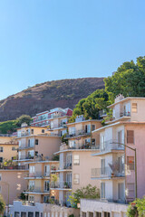 Multi-storey apartment buildings with balconies against the mountain and sky at San Francisco, CA