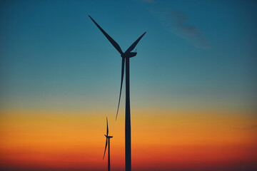 Windmill farm park in silhouettes with colorful sky.