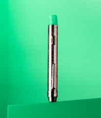 Torch pen on green background