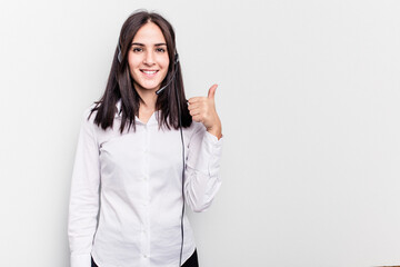 Telemarketer caucasian woman working with a headset isolated on white background smiling and raising thumb up