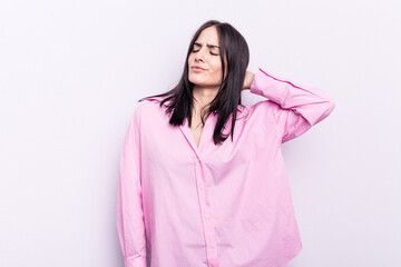 Fototapeta premium Young caucasian woman isolated on pink background tired and very sleepy keeping hand on head.