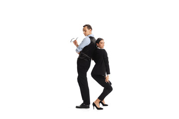 Portrait of two business people, man and woman posing isolated over white background. Office romance