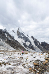 Trekkers on Gondogoro glacier with Laila peak, Gondogoro La trek in Pakistan