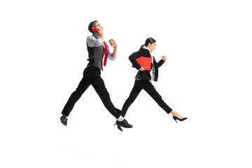 Fototapeta na wymiar Portrait of man and woman, business people working on their way, posing in action isolated over white background