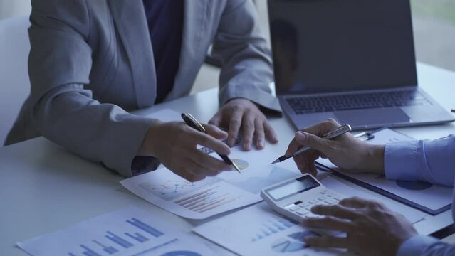 Two businessmen agree on the company budget. Meeting the current business team professional investor Work with a finance manager job. and two colleagues discussing 4k finance