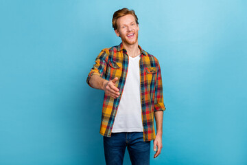 Photo of handsome positive good mood redhead guy dressed checkered shirt give hand welcome you...