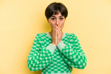 Young caucasian woman with a short hair cut isolated shocked covering mouth with hands.