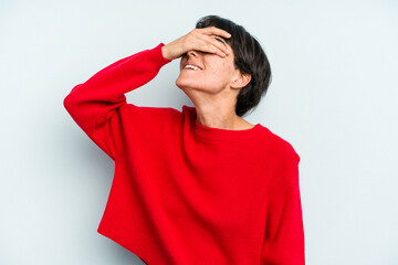 Young caucasian woman with a short hair cut isolated laughs joyfully keeping hands on head. Happiness concept.