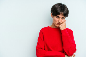 Young caucasian woman with a short hair cut isolated who feels sad and pensive, looking at copy space.