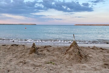 Sand castle on the beach at the Black Sea at sunset - 522017698