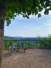 Two bicycles with the view to Vilnius, Lithuania. Vilnius is capital of Lithuania. Active life style concept. Summer activities. Vilnius panorama. Travel by bicycles