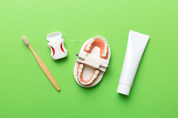 toothpaste and toothbrush top view with copy space on colored background. Flat lay. Dental hygiene....