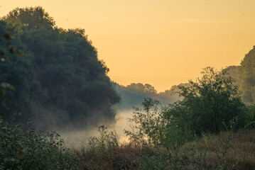 Early morning river.  fog trees. sunlight mist  water. Olanesti Moldova Dniester river reflection, beautiful   summer landscape sunrise quiet fishing spot forest
