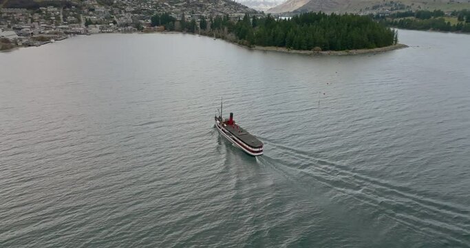 Aerial view of boat coming in to dock in Queenstown - New Zealand