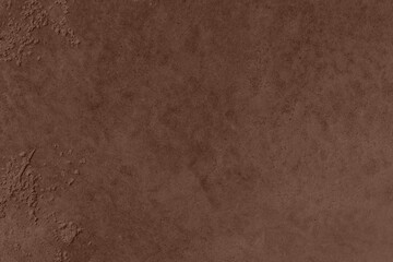 Saturated dark brown colored low contrast Concrete textured background. Empty colorful wall texture with copy space for text overlay and mockups. 2023, 2024 color trend