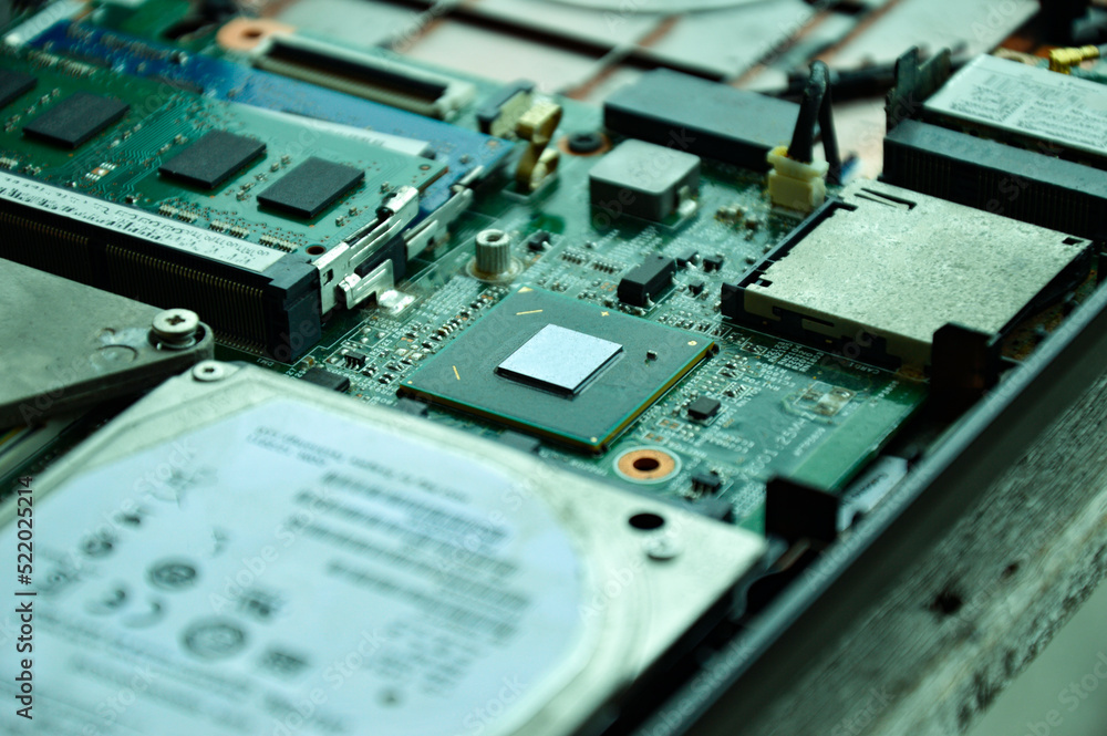 Poster close-up of a part of a computer motherboard, with many ic chips visible.
