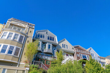 View of houses' exterior from below in San Francisco, CA