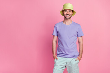 Photo of cool good mood gentleman boy wear violet outfit trendy head accessory stand empty space isolated on pink color background