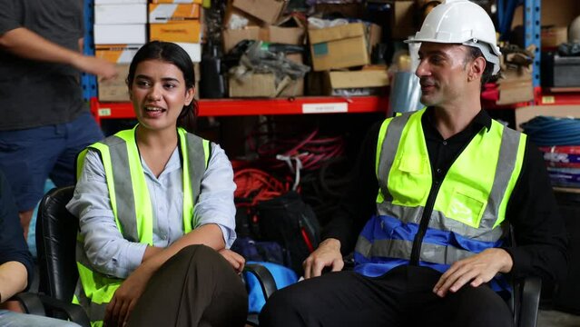 Group warehouse worker people discussion talking together at warehouse factory workplace. Relax. Professional engineering teamwork.