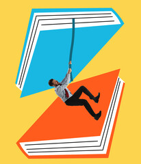 Young business man climbing rope from one book to another one over yellow background. Contemporary...