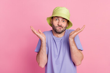 Portrait of attractive clueless guy dressed fashionable clothes shrugging shoulders isolated on...