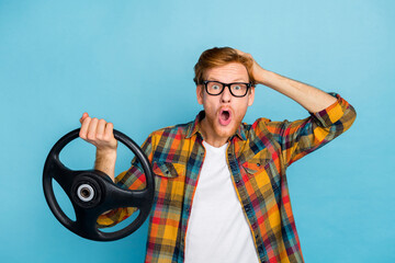 Photo of speechless open mouth guy in glasses with red hairstyle hold steering wheel hand on head...