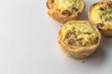 Mini quiche with bacon and herbs with copy space