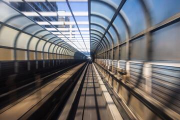 Fototapeta premium Motion blur of train moving inside tunnel