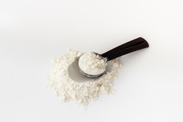 Whey protein powder on scoop. Fitness and gym diet nutrition